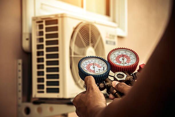 Professional Air Conditioning Service technician working in Wheaton, IL